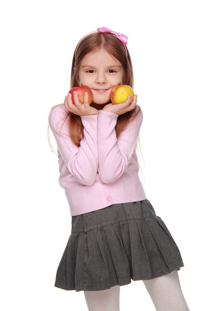 Little girl holding two apples - Zdjęcie, obraz