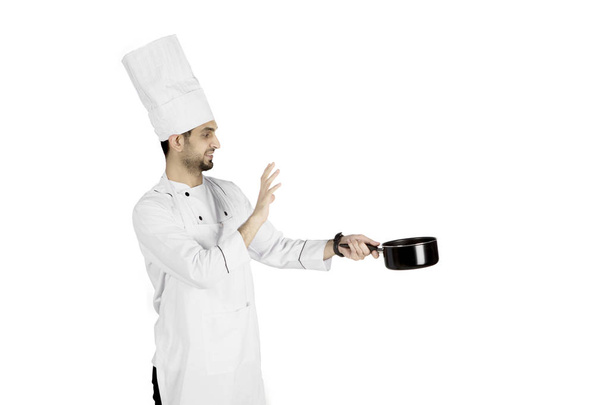 Italian male chef holding a pan on studio - Fotoğraf, Görsel