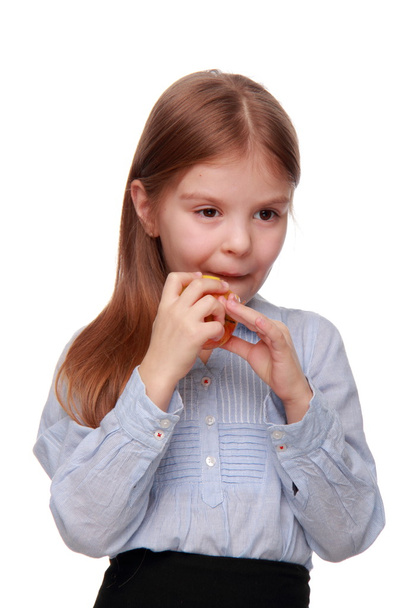 Little girl eating an apple - Photo, Image