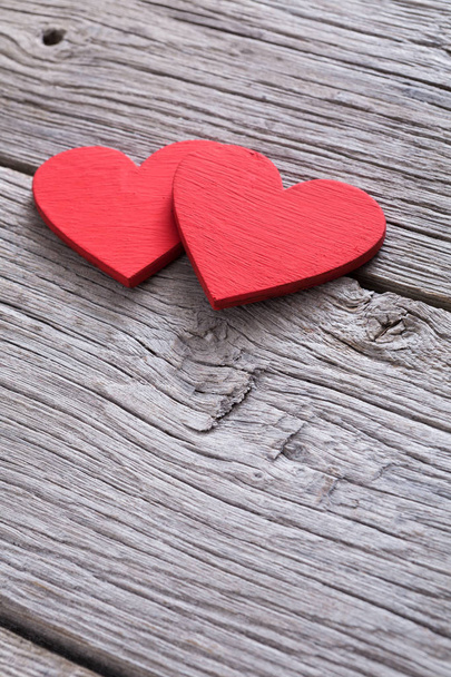 Valentine background with handmade hearts on rustic wood - Fotografie, Obrázek