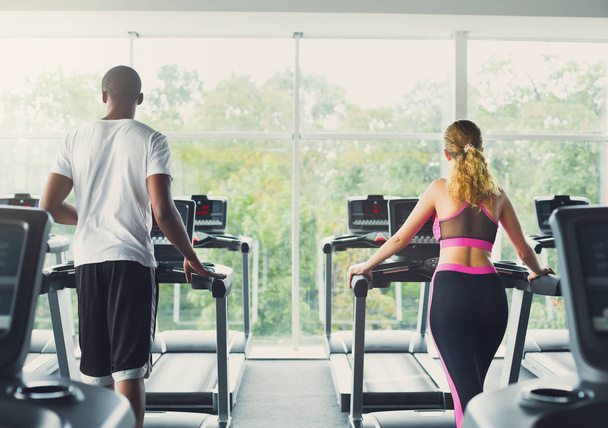 Man and woman, couple in gym on treadmills - Foto, Imagem