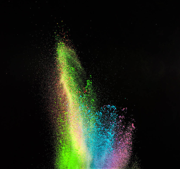 Launched colorful powder, isolated on black background - Фото, изображение