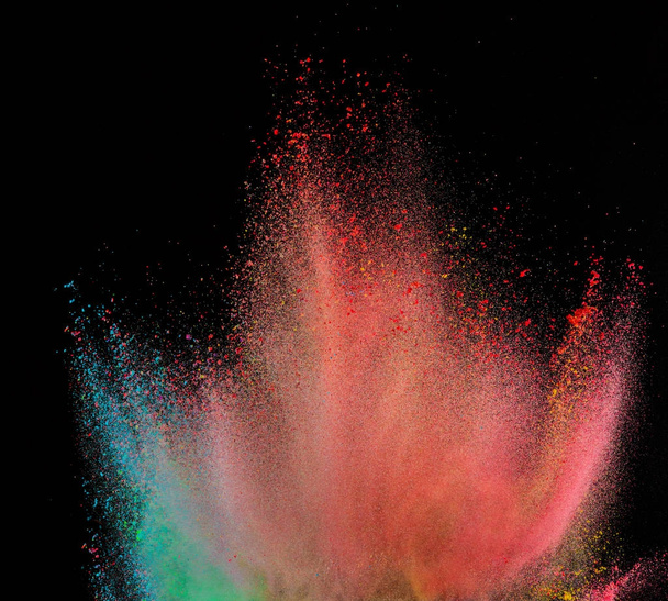 Launched colorful powder, isolated on black background - Photo, image