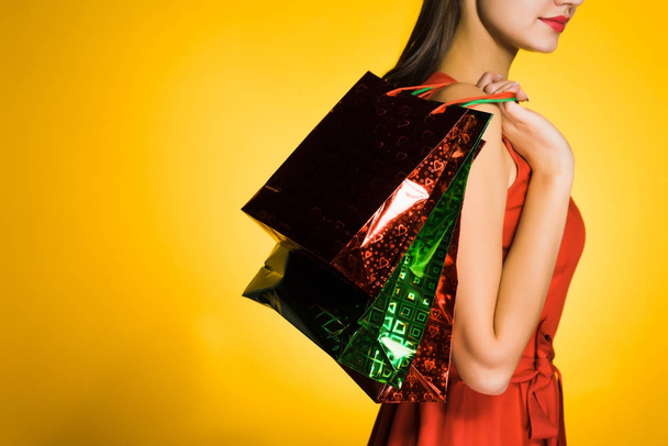 young girl shopaholic bought a lot of gifts for the new year - 写真・画像