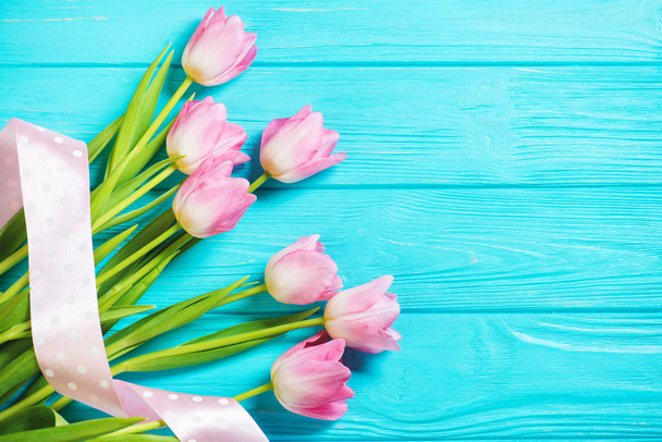Wooden blue background and pink tulips - Photo, Image