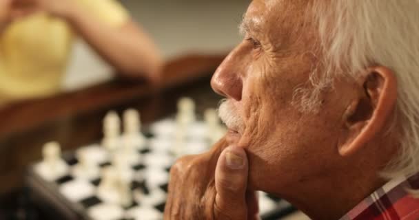 Grandpa Playing Chess Board Game With Grandson At Home - Video, Çekim