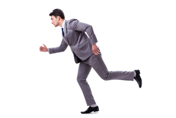 Молодой бизнесмен бежит вперед изолированный на белом
 - Фото, изображение
