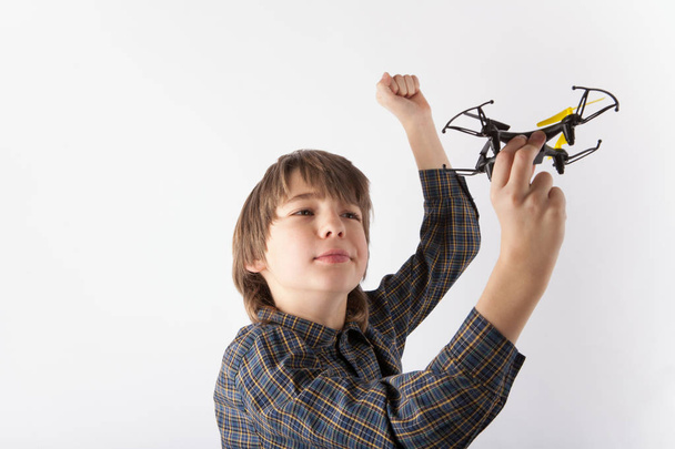 Boy holding a drone - Фото, зображення