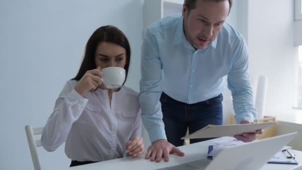 Young brunette embracing arm of colleague while flirting - Footage, Video