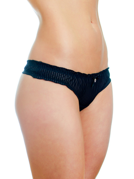 Vista frontal del cuerpo femenino sexual en lencería negra. Aislado sobre blanco
 - Foto, imagen