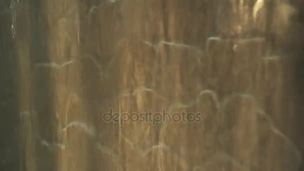 Artificial waterfall on the background of stone wall stock footage video - Záběry, video