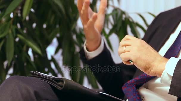 Businessman or politician giving live interview. Body language gesticulation with hands. Close up shot. - Footage, Video