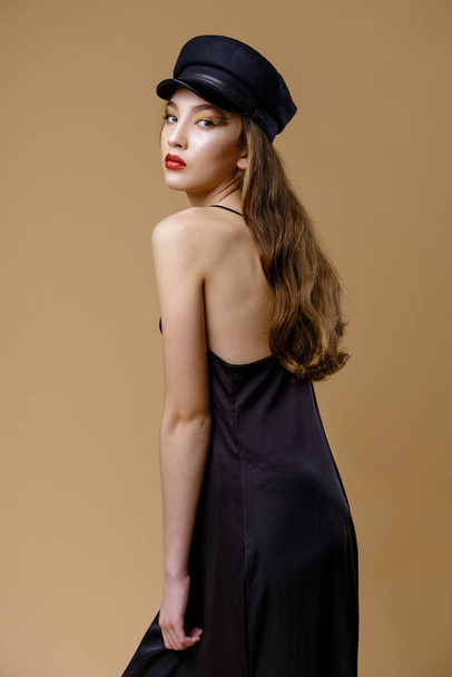 Gorgeous young fashion model posing on studio background  - Valokuva, kuva