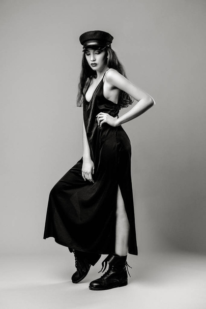 Black and white full length portrait of gorgeous young fashion model posing on studio background  - Photo, image