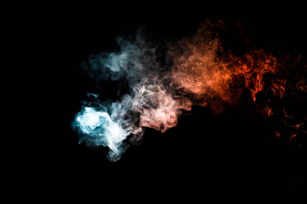 Colorful smoke clouds on dark background - Photo, Image