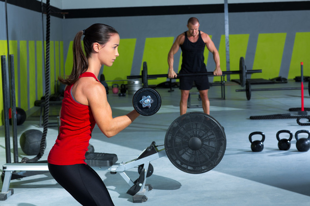 girl dumbbell and man weight lifting bar workout - Photo, image