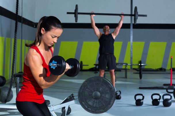 girl dumbbell and man weight lifting bar workout - Fotoğraf, Görsel