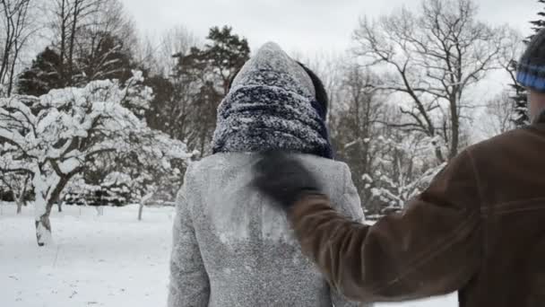 Man clean woman coat snow - Footage, Video