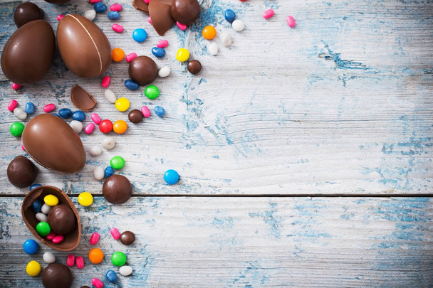 Chocolate Easter Eggs Over Wooden Background - Photo, image