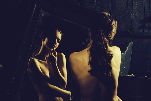 Sensual girl near mirror - Фото, изображение