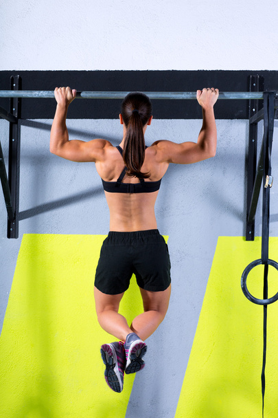 Crossfit toes to bar woman pull-ups 2 bars workout - Photo, image