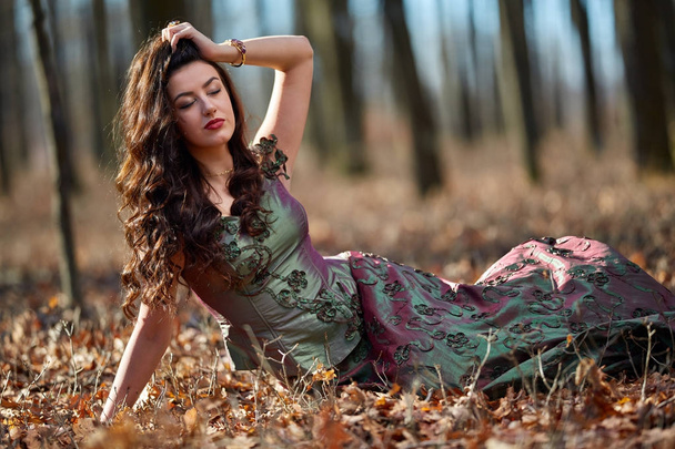 Beautiful woman in green dress outdoor - Valokuva, kuva