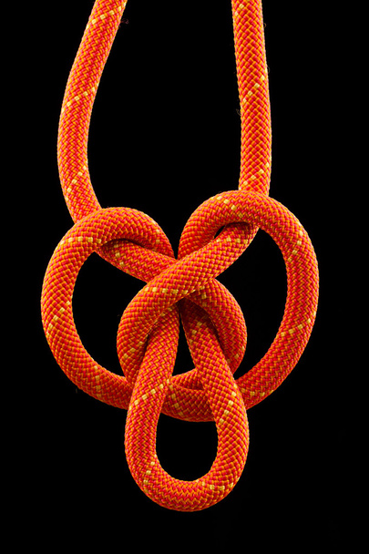 Rope knot isolated on black background - Foto, Imagen