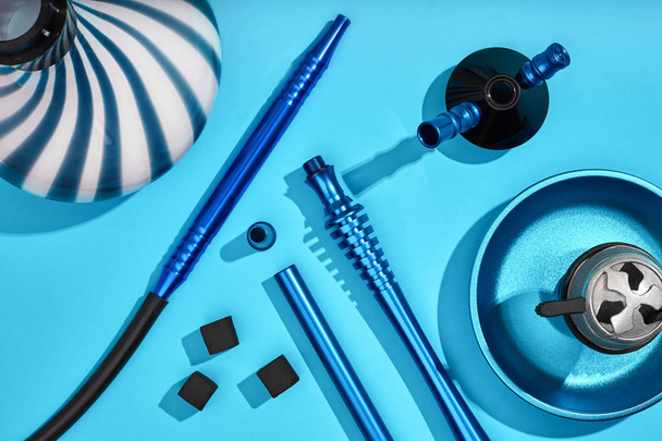 Top view of Hookah parts on light blue background - Photo, Image