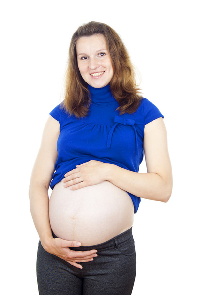 pregnant woman touching her stomach - 写真・画像