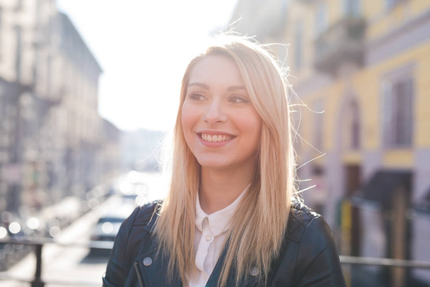 Portrait young woman beautiful blonde hair outdoor looking away, smiling - Zdjęcie, obraz