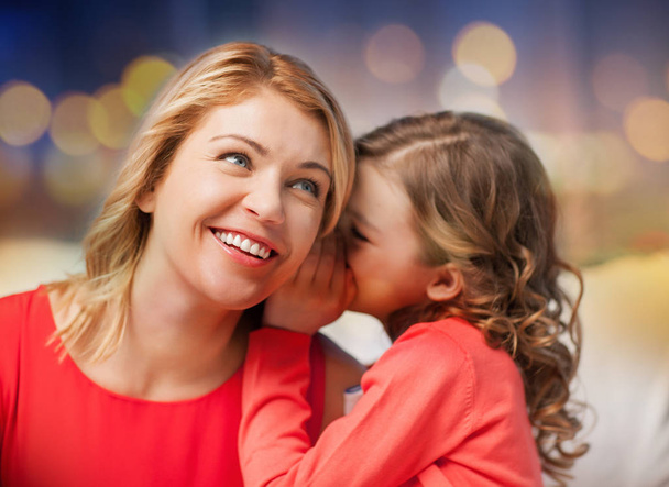 happy mother and girl whispering into ear - Fotoğraf, Görsel