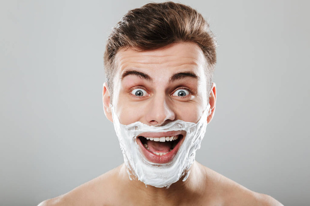 Close up portrait of an excited man with shaving foam - Φωτογραφία, εικόνα
