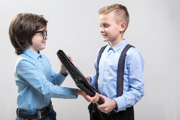 Glad children imagining themselves as business colleagues - Фото, изображение