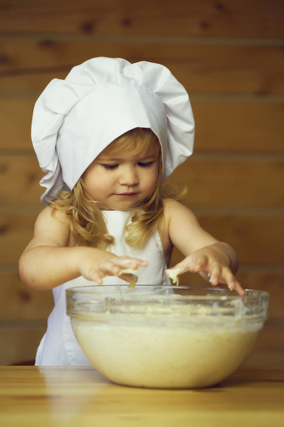 happy boy child cook kneading dough - Zdjęcie, obraz