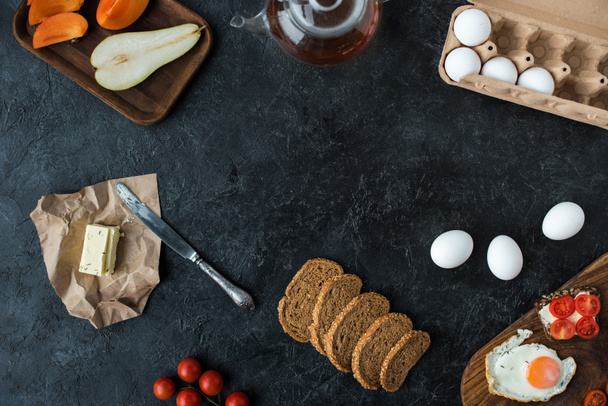 flat lay with ingredients for healthy breakfast on dark tabletop - Photo, Image