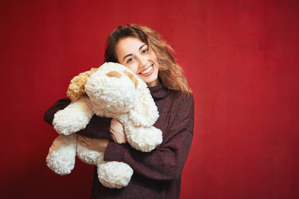 happy beautiful woman with a toy dog - Valokuva, kuva