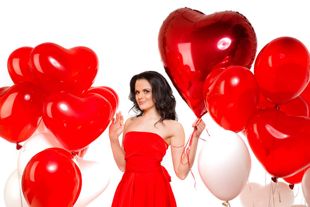 Beautiful girl, stylish fashion model with balloons in the shape of a heart. Woman on Valentine's Day. Symbol of love. - Fotografie, Obrázek