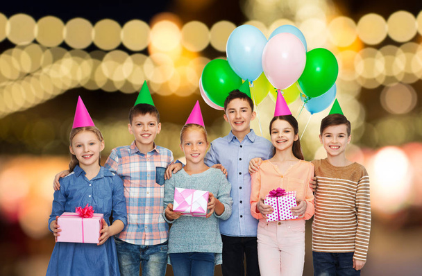 happy children with gifts at birthday party - Foto, imagen