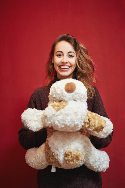 happy beautiful woman with a toy dog - Foto, Imagen