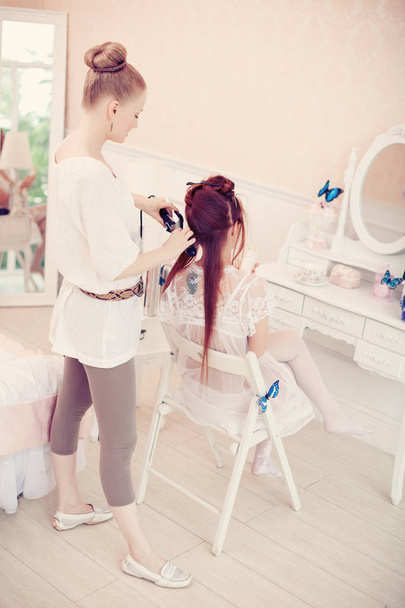 Hair stylist makes the bride on the wedding day - Photo, image