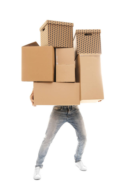 Man with moving boxes on white background - Φωτογραφία, εικόνα