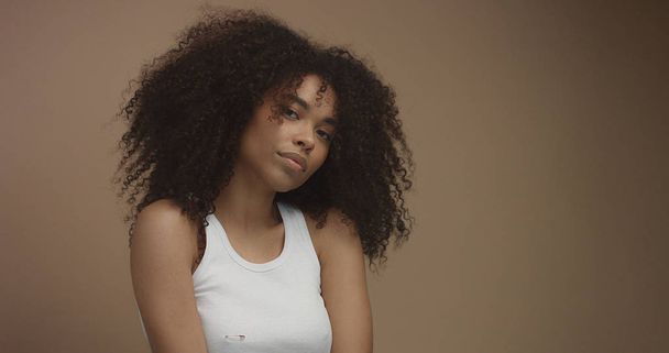 mixed race black woman portrait with big afro hair, curly hair - Fotografie, Obrázek