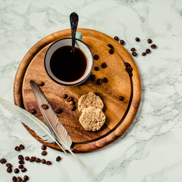 A cup of coffee and biscuits. Coffee break or breakfast. Minimal - Photo, Image