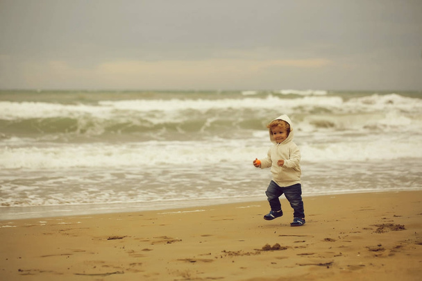 Joyful boy running at beach  - Fotoğraf, Görsel