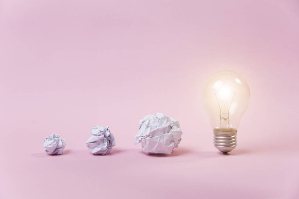 glowing lightbulb with crumpled paper. concept brainstorming  - 写真・画像