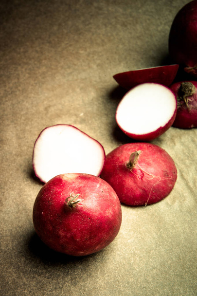 Red radishes whole and sliced - Foto, Imagen