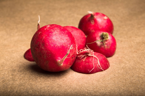 Red radishes whole and sliced - Fotoğraf, Görsel
