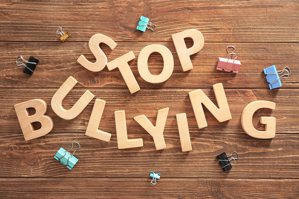 Text "Stop bullying" on wooden background - Foto, imagen