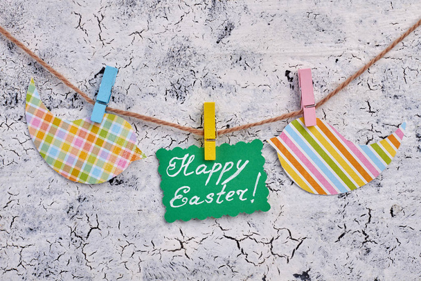 Easter greeting card on rope with clothespins. - Photo, image