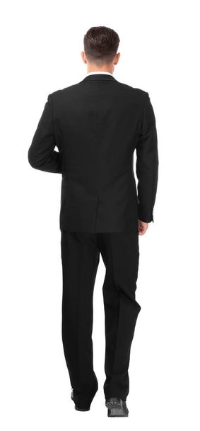 Handsome man in elegant suit on white background, back view - Photo, Image